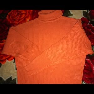 Orange turtleneck sweater